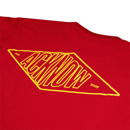 Close-up of the yellow diamond Acknow graphic on the back of the red Alfa T-shirt